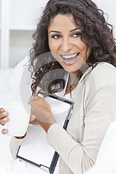 Woman Laughing Tablet Computer Drinking Coffee