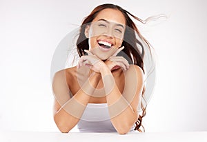 Woman, laughing or windy hair in skincare grooming, healthcare wellness or keratin treatment on white background in