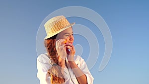 Woman in lavender field - Happy Lady in hat eat apricot on sunny day, wandering in lavender field, appreciating nature