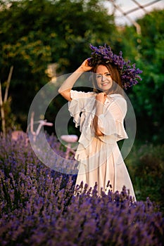 Woman in lavender wreath and whitre dress