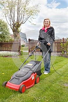 Woman with lawn mower