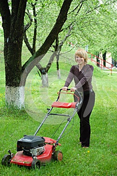 Woman with lawn-mower