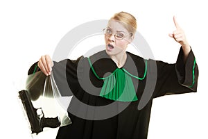 Woman lawyer with gun bag marked evidence for crime.