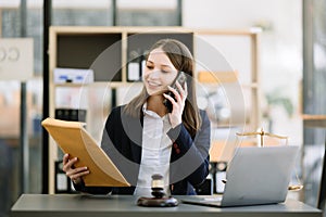 Woman lawyer working and gavel, tablet, laptop in front, Advice justice and law concept