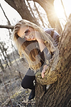 Woman lay on a tree trunk