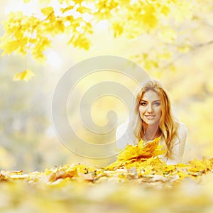 Woman laying in autumn park