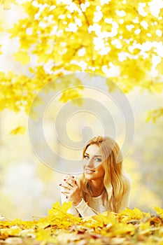 Woman laying in autumn park