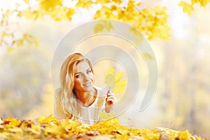 Woman laying in autumn park