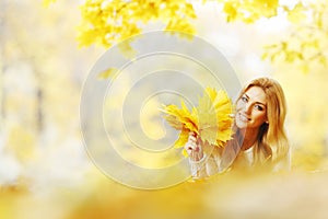 Woman laying in autumn park