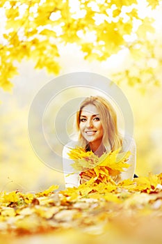 Woman laying in autumn park