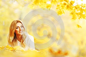 Woman laying in autumn park