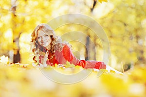 Woman laying in autumn park