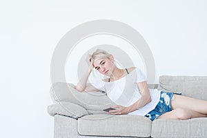 Woman laying couch phone idle lifestyle addiction