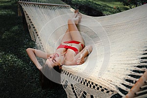 Woman laying down on a hammock