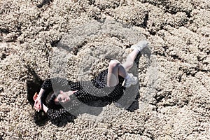 Woman laying on a dry moss