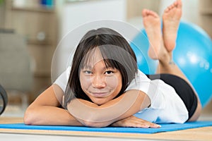 Woman laying in exercise clothes