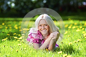 Woman laying on flower meadow