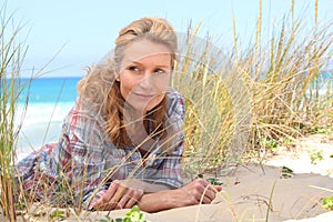 Woman laying on the sand