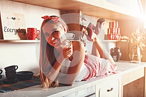 Woman Laying And Smiling With Cupcake photo