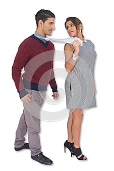 Woman leading a man by pulling him by his necktie