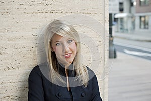 Woman Leaning Against Wall