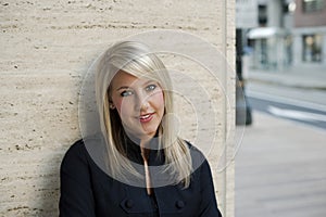 Woman Leaning Against Wall