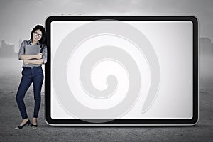 Woman leaning in big billboard