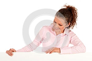 Woman leaning on a billboard