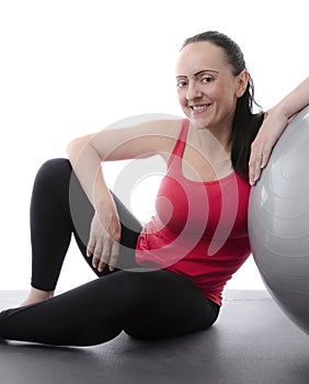Woman leaning on an exercise ball