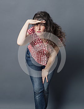 Woman leaning forward with hand on forehead to explore