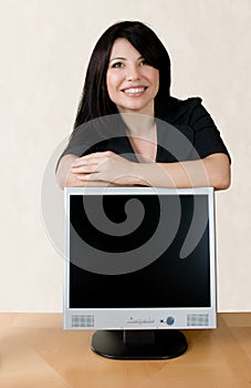 Woman leaning on lcd screen