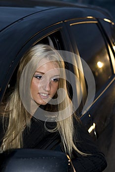 Woman leaning out a car window
