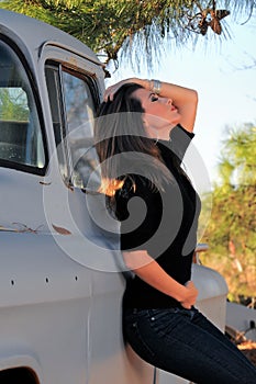 Woman Leaning on Truck