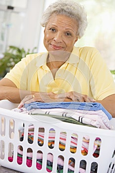 Woman Leaning On Washing Basket