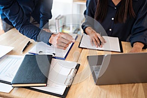 Woman learn and teach tutor concept education helping each other sitting in a table at class room