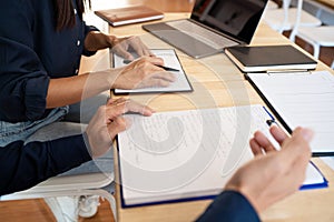 Woman learn and teach tutor concept education helping each other sitting in a table at class room