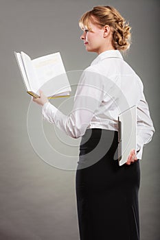 Woman learning with ebook and book. Education.