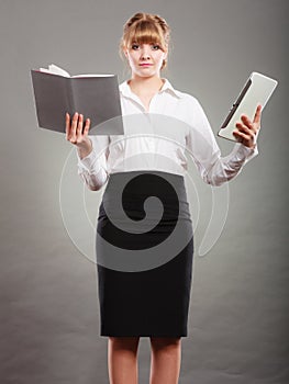 Woman learning with ebook and book. Education.