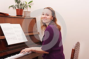 Woman learning to play the piano