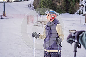 Woman learning to ski. Young woman skiing on a snowy road in the mountains