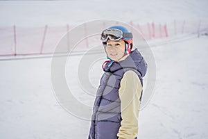 Woman learning to ski. Young woman skiing on a snowy road in the mountains