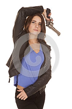 Woman leather jacket gun over head