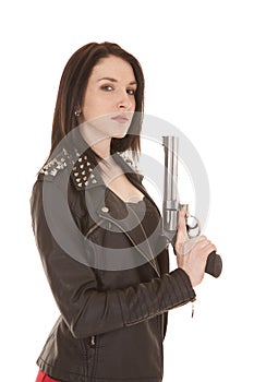 Woman leather jacket gun up