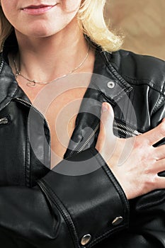 Woman with leather jacket and necklace