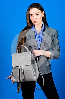 Woman with leather knapsack. Stylish woman in jacket with leather backpack. Formal style accessories. Backpack for daily