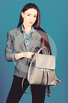 Woman with leather knapsack. Stylish woman in jacket with leather backpack. Formal style accessories. Backpack for daily