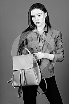 Woman with leather knapsack. Stylish woman in jacket with leather backpack. Formal style accessories. Backpack for daily