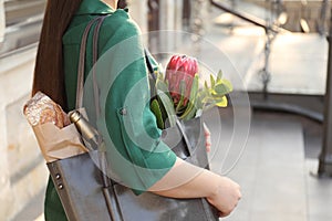 Woman with leather shopper bag outdoors, closeup