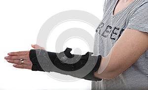 Woman with left hand orthosis