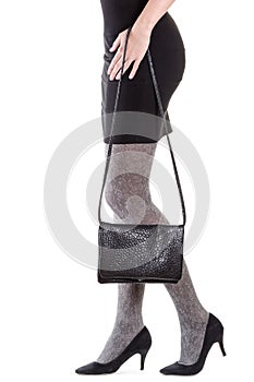 Woman legs with bag